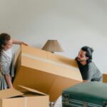 Two People Moving a Box