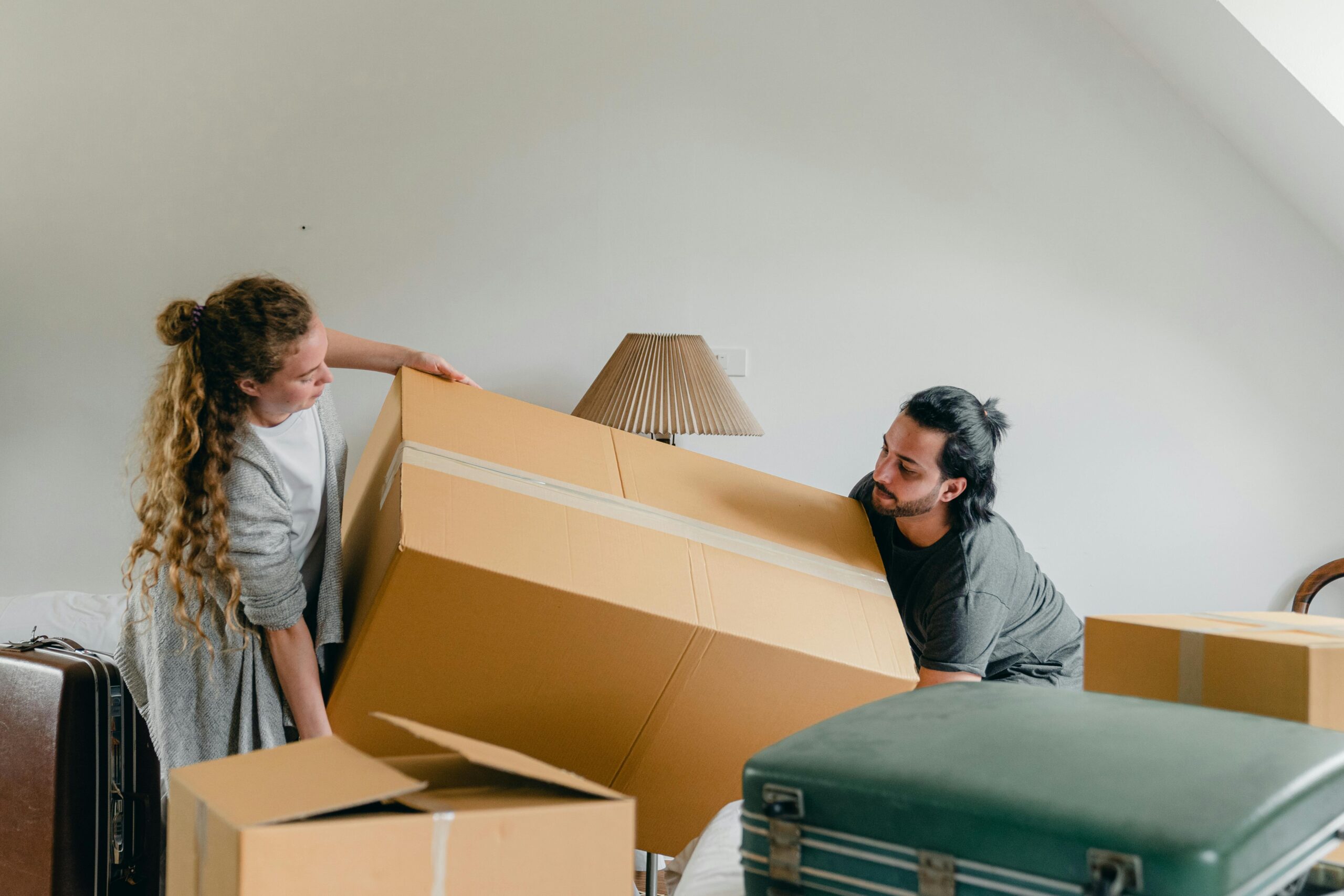 Two People Moving a Box